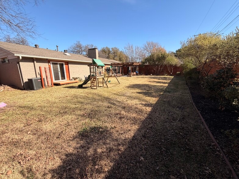 Large backyard with children's playset if you want to keep. - 3414 Winged Foot Ct