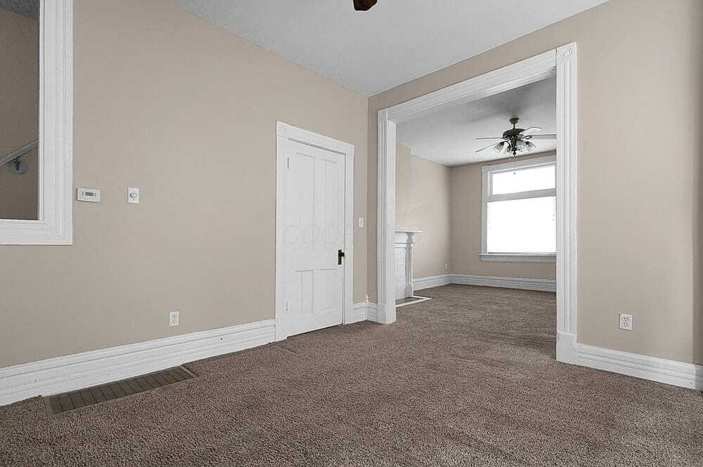 Dining room with living room in background - 328 W 1st Ave