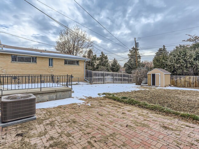Building Photo - Evolve Real Estate: Available 8/8/26 Brick Tudor with Large Yard and Finished Basement!