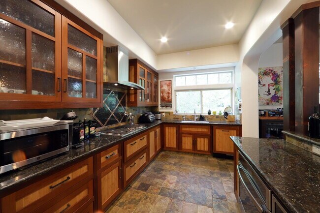 Building Photo - Don't miss this amazing opportunity to rent a higher end home nestled in the trees in the coveted...