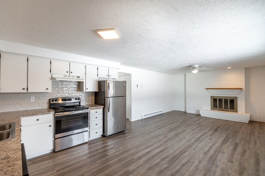 Large, eat-in kitchen with fireplace - 3507 E 57th Ave