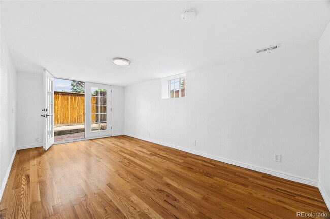 Building Photo - "Spacious 5-Bedroom Gem with Hardwood Floors & Cozy Fireplace in Denver's Heart!"