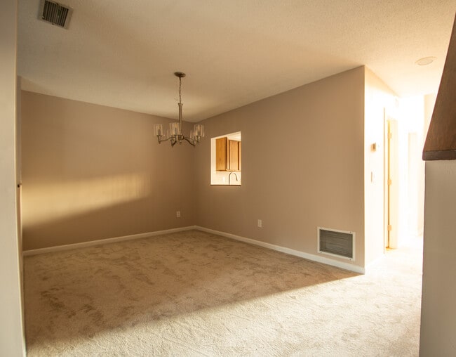 Dining area with Brushed Nickel Chandelier - 115 Beechnut St