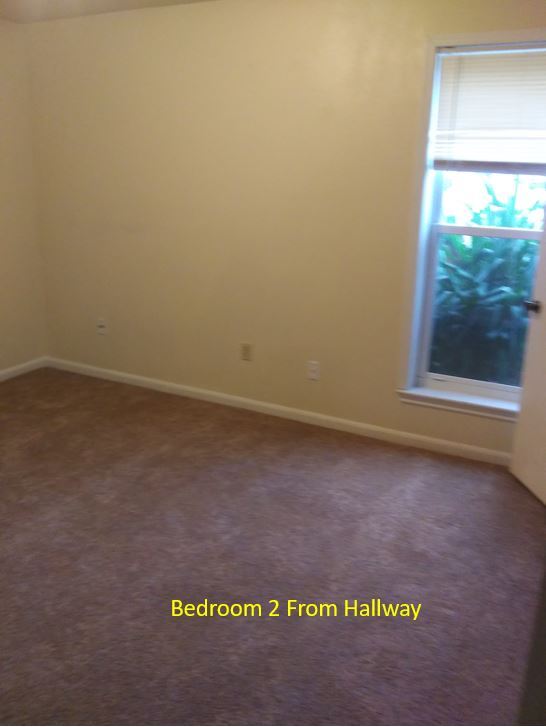 Bedroom 2 looking in from hallway. Closet on right. - 7933 Bles Ave