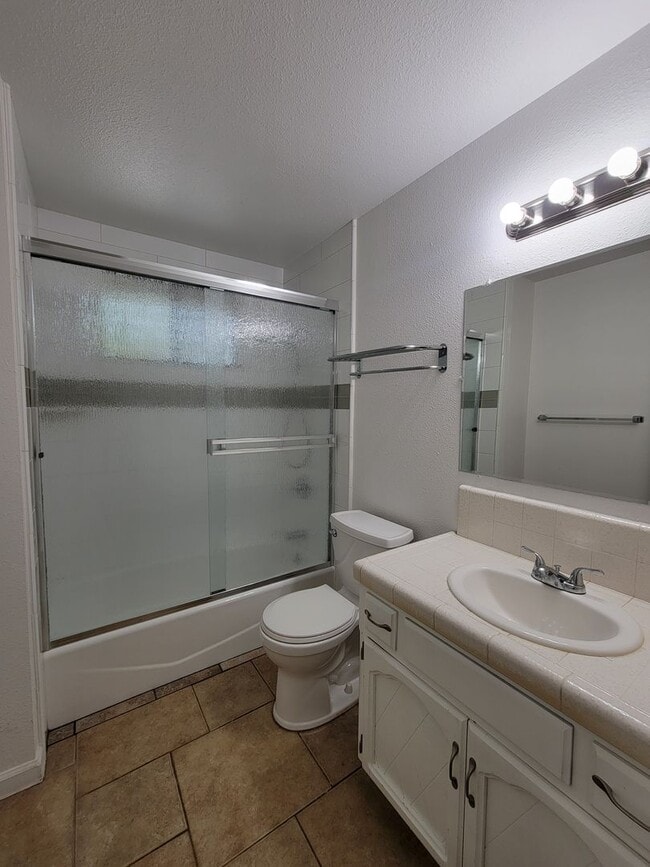 Building Photo - Condo with open floor plan and a two-car g...