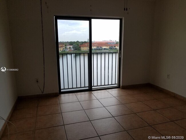 Building Photo - 9917 W Okeechobee Rd