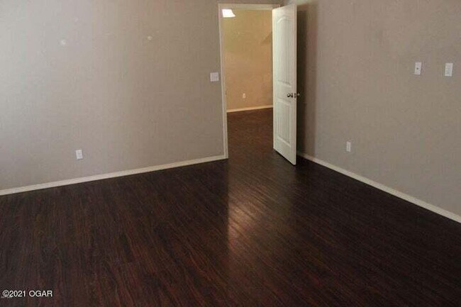 Building Photo - 5061a Raintree Cir