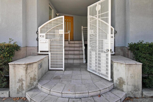 Building Photo - Live in one of San Diego’s most desirable locations in This award-winning architectural gem, "7 o...