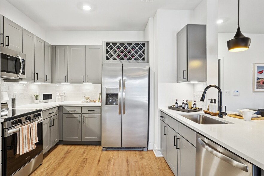 Kitchen with Quartz Countertop and Stainless Steel Appliances. - Cendana Craig Ranch