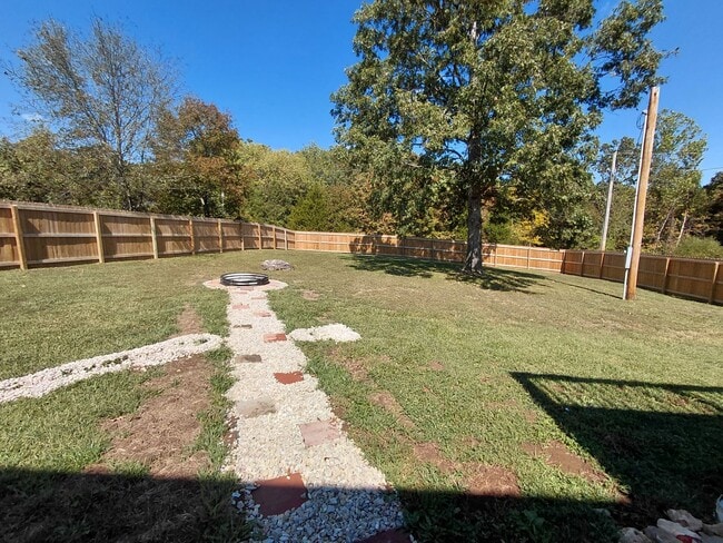 Building Photo - Fenced home close to post
