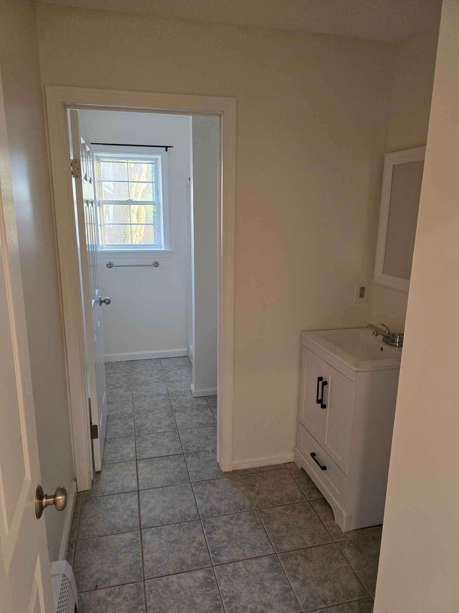 Downstairs bath with door separating sink area - 133 Mitchell St
