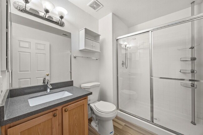 Building Photo - Charming and spacious single-story townhome nestled within a gated community in the desirable Nor...