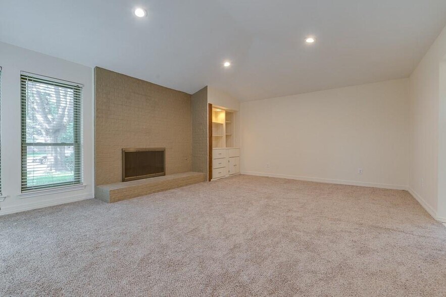 living room with fireplace - 2000 Geneva Dr