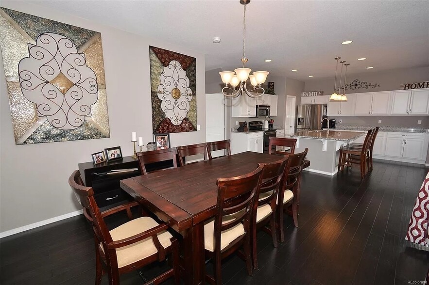 Dining room with optional playroom or office attached via barn door - 8782 Windy Plains Ct