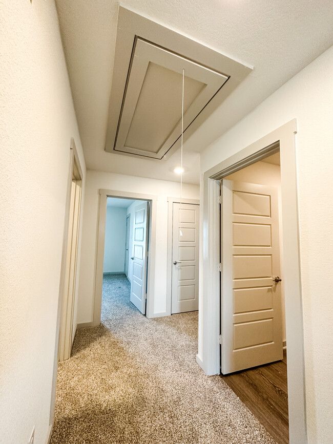 Upstairs Hallway with Attic Access - 214 New Hampton Way