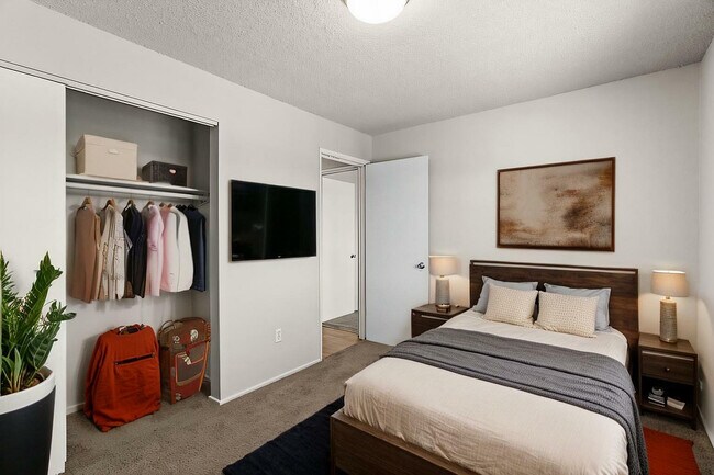 Experience serene comfort in this beautifully designed bedroom. - University Crossing Apartments