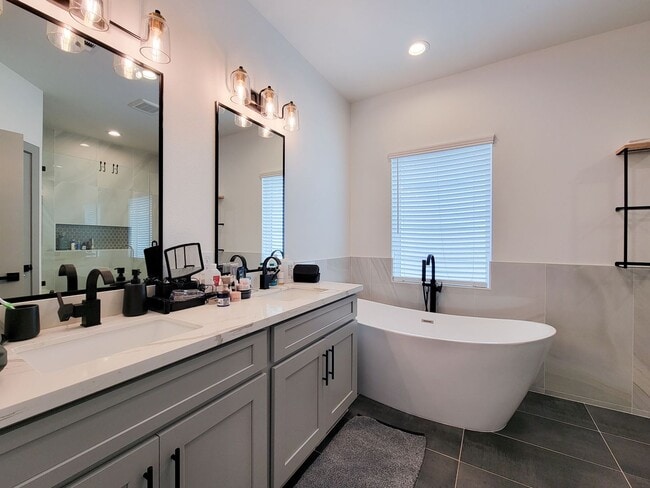 Building Photo - This 4-bedroom, 3-bathroom, two-story residence comes with a generous two-car attached garage. Re...