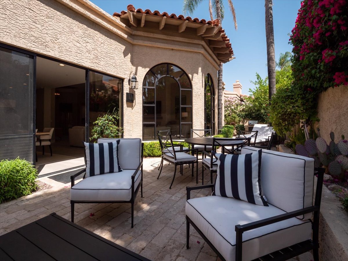 The back courtyard, which also features a sofa and coffee table by the 2 chairs (sofa not shown) - 8437 N 84th St