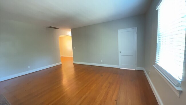 Building Photo - Charming 2BR with Sunroom, Hardwood Floors & Lawn Care Included