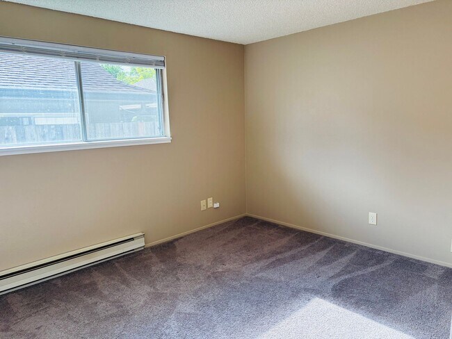 Building Photo - Bright 2 BR Carter Park Living with Fireplace, Carport, and Tons of Storage!