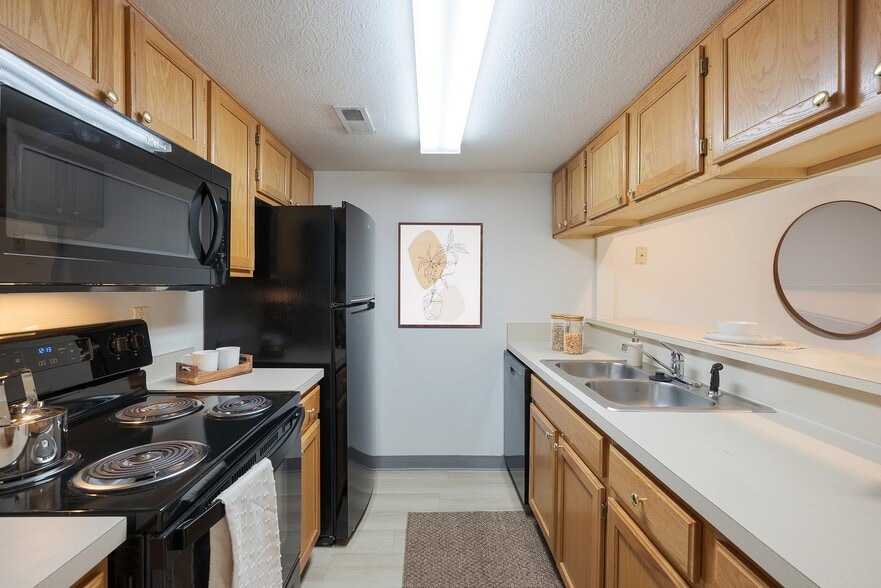 BenningtonPond_2026_Kitchen_VirtuallyStaged - Bennington Pond Apartments