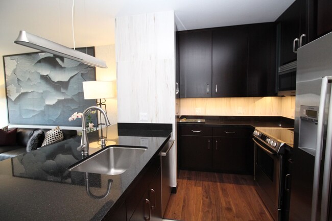 Building Photo - Upscale Designer-Furnished Condo for Rent