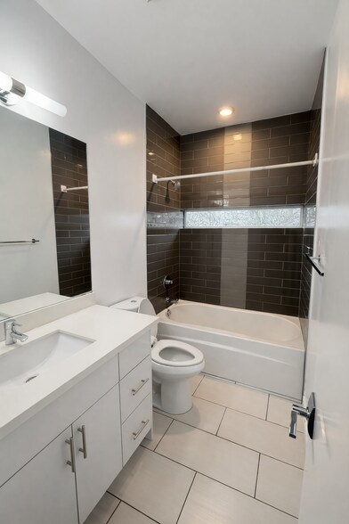 Second stylish full bathroom with designer tile work - 1733 NW 63rd St