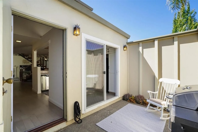 Building Photo - Spacious 1,550 Sq Ft Townhome | 2-Car Garage & High Ceilings w/ Exposed Beams