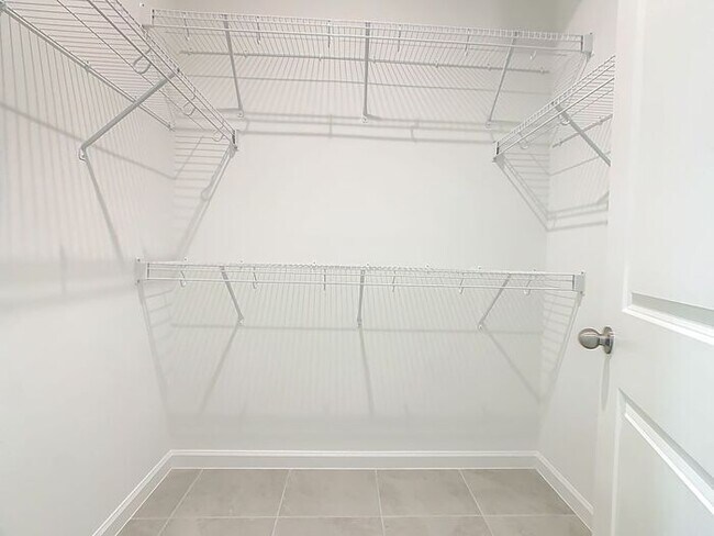 Building Photo - New Luxury Townhome in Celebration with All porcelain tiled floors. Island Village new construction