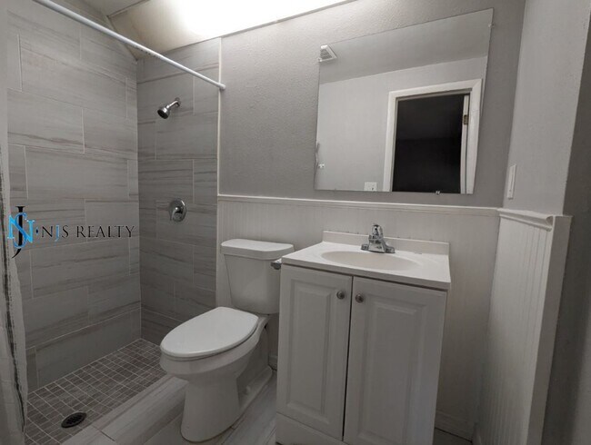 Building Photo - Just Reduced!  2/2/1 with  RENOVATED baths & kitchen, fenced yard, NEW lvp flooring and a OVERSIZ...