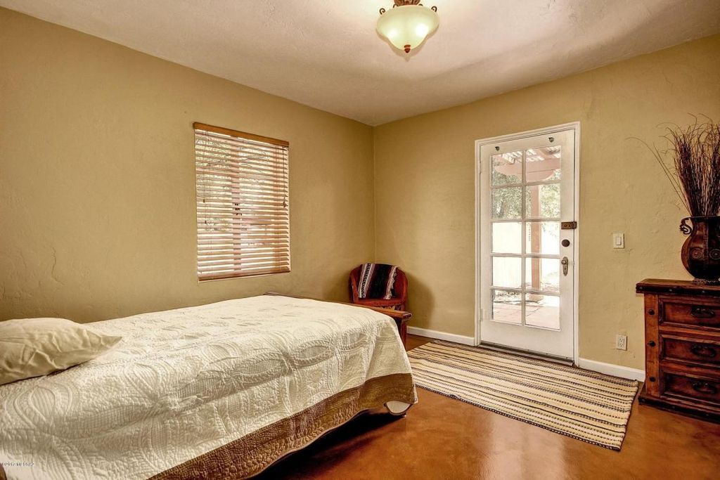 Second bedroom with door to back patio. Large master bedroom with french doors to back patio. NOTE: Furniture not included. Rented unfurnished. - 2648 E Drachman St