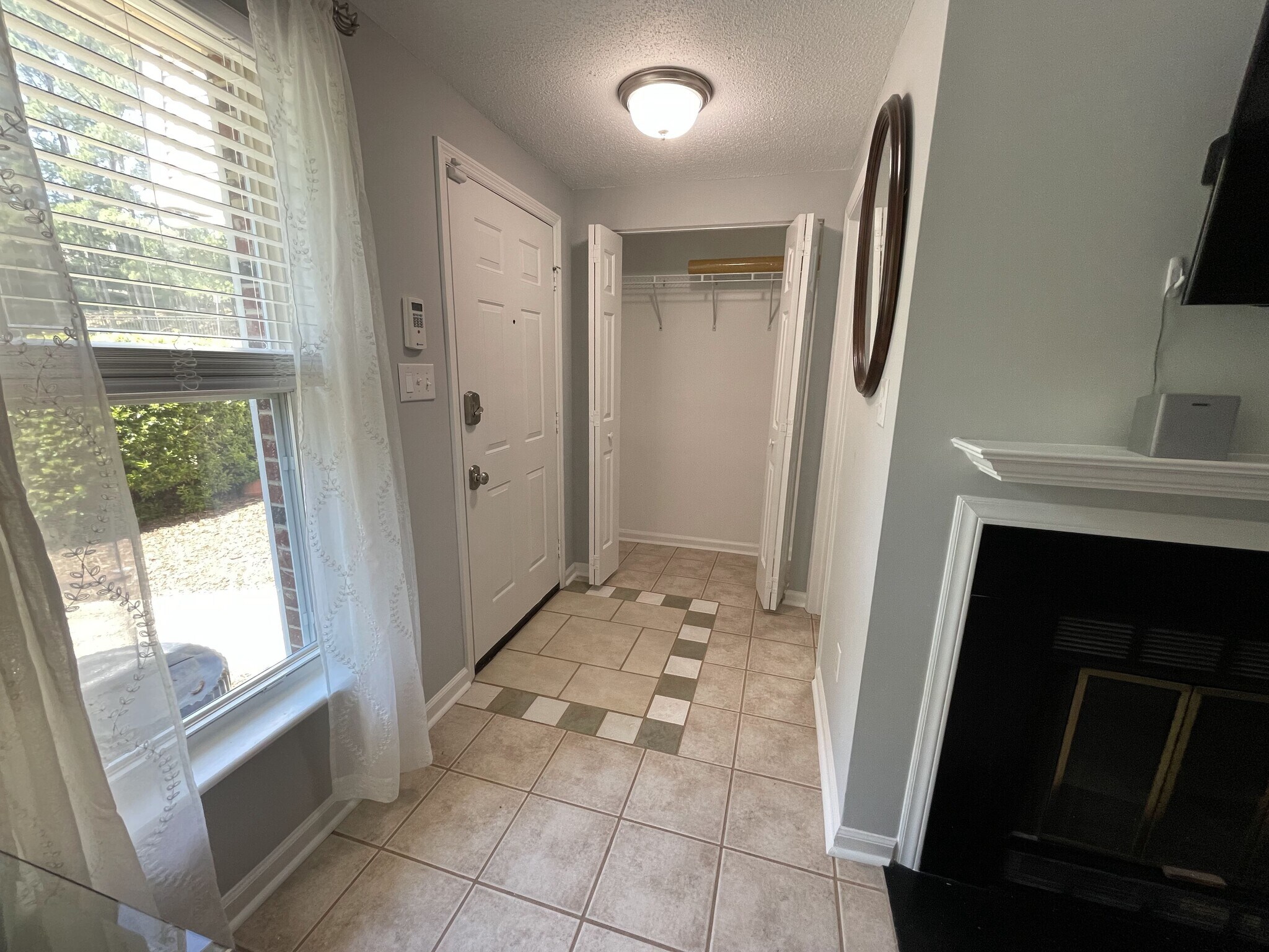 Front entrance with good size coat closet, electronic door lock, and security system keypad - 4204 Whistler Ct