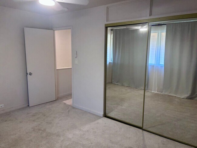 Building Photo - Available Now | 2 Bedroom, 2 Bathroom Townhouse with 1 Assigned Parking Stall at Tropic Gardens 1