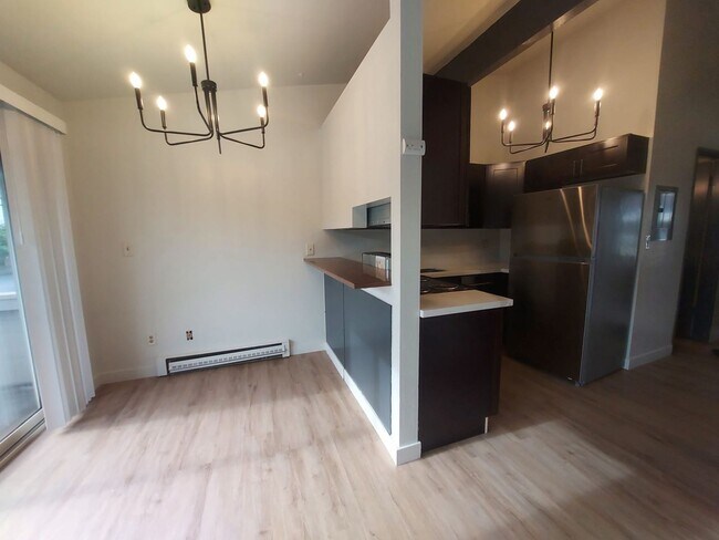 Building Photo - North Seattle 1BR with Private Balcony, Natural Light, and Modern Flooring