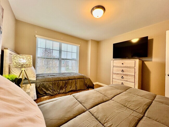 Building Photo - Executive corporate rental features community pool. Fully furnished and includes all utilities.