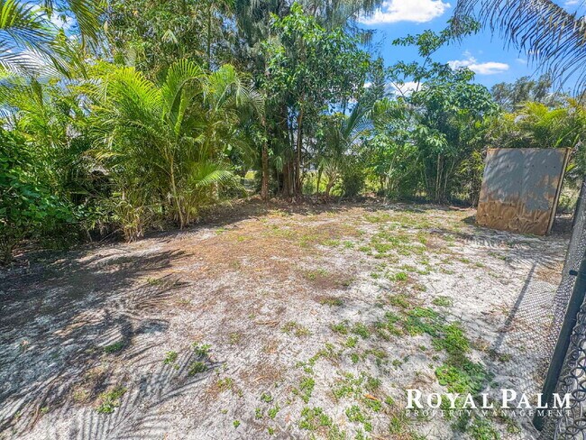 Building Photo - Tree-Lined 2BR/1BA Fort Myers Duplex with Fenced Yard, Storage Shed & In-Unit Laundry!