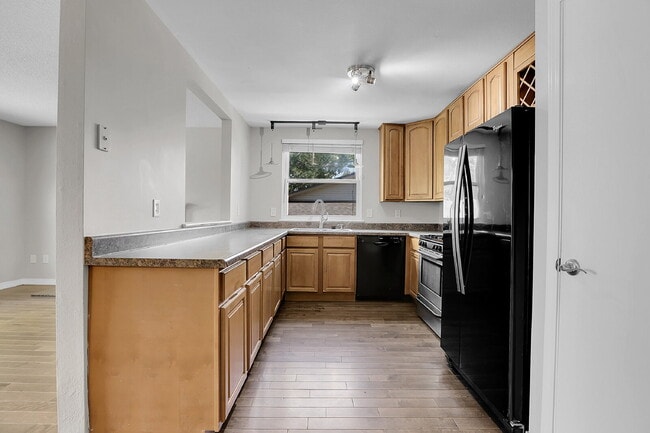 Building Photo - $2,720.95 - 4 bed, 2 bath, located in Aurora with attached Garage and In Unit Washer and Dryer!