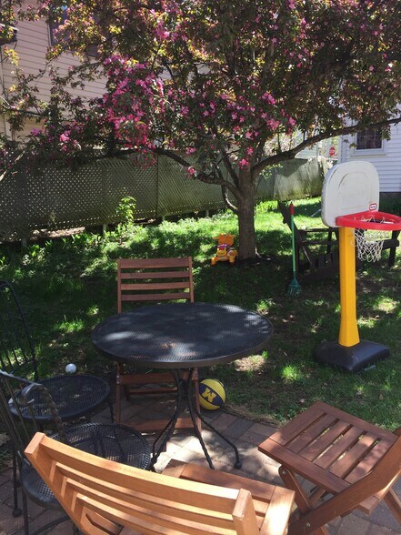 Backyard patio with room for a table and a grill. - 1347 W Highland Pkwy