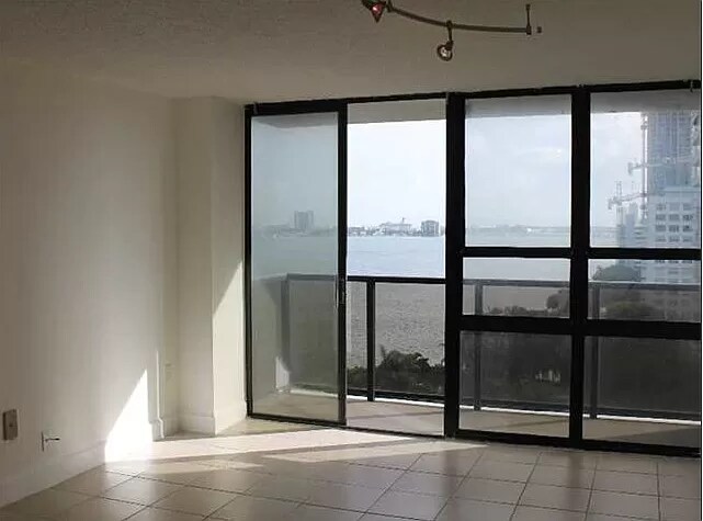 Living room to balcony - Pre renovation - 600 NE 36th St