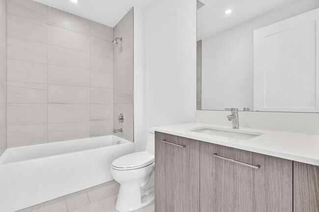 Building Photo - Stunning High-Rise Condo with Ocean Views | Prime Beach Location