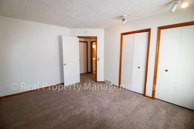 Building Photo - 2-Bed, 1-Bath Upper Unit with Garage & Porch – Steps from Paul Henry Trail