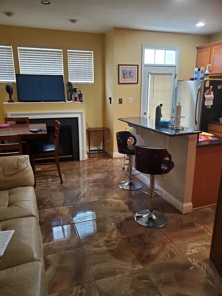 Kitchen/Living area with fireplace - 11808 Oxbridge Dr