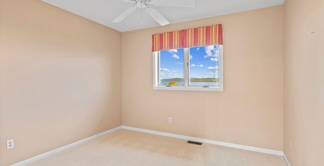 Building Photo - Lakefront End-Unit Condo with Crystal Lake...