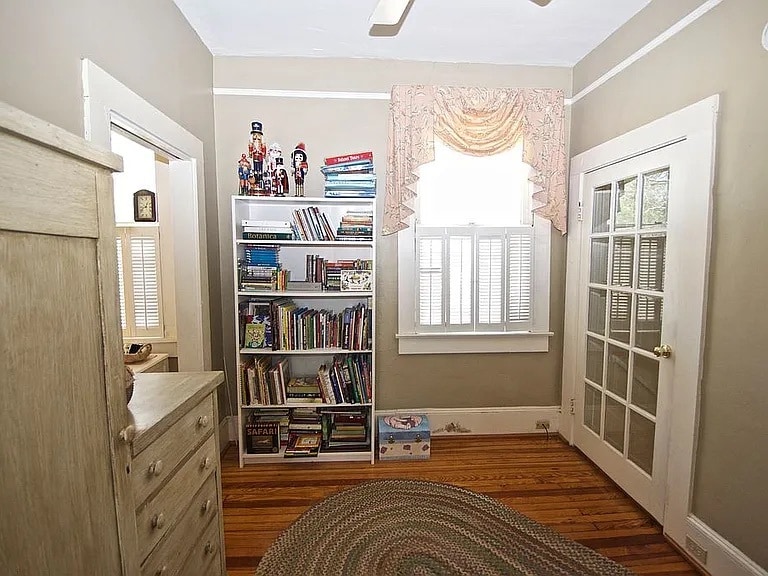 Upstairs hallway - stairs through left door. Bathroom through right door. - 1203 Woodrow St