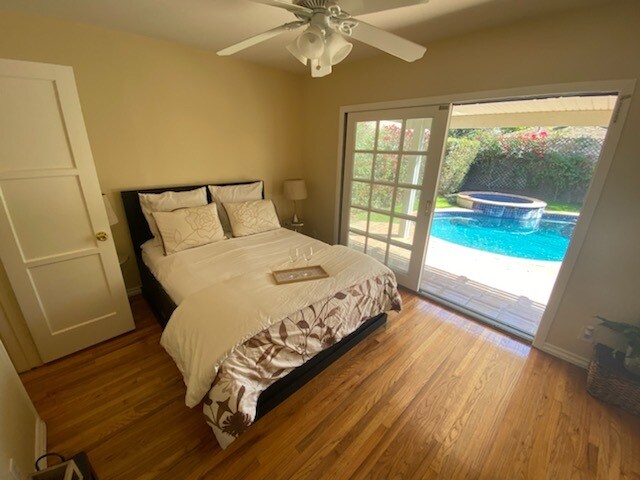 master bedroom overlooking the gorgeous pool - 14024 Peach Grove St