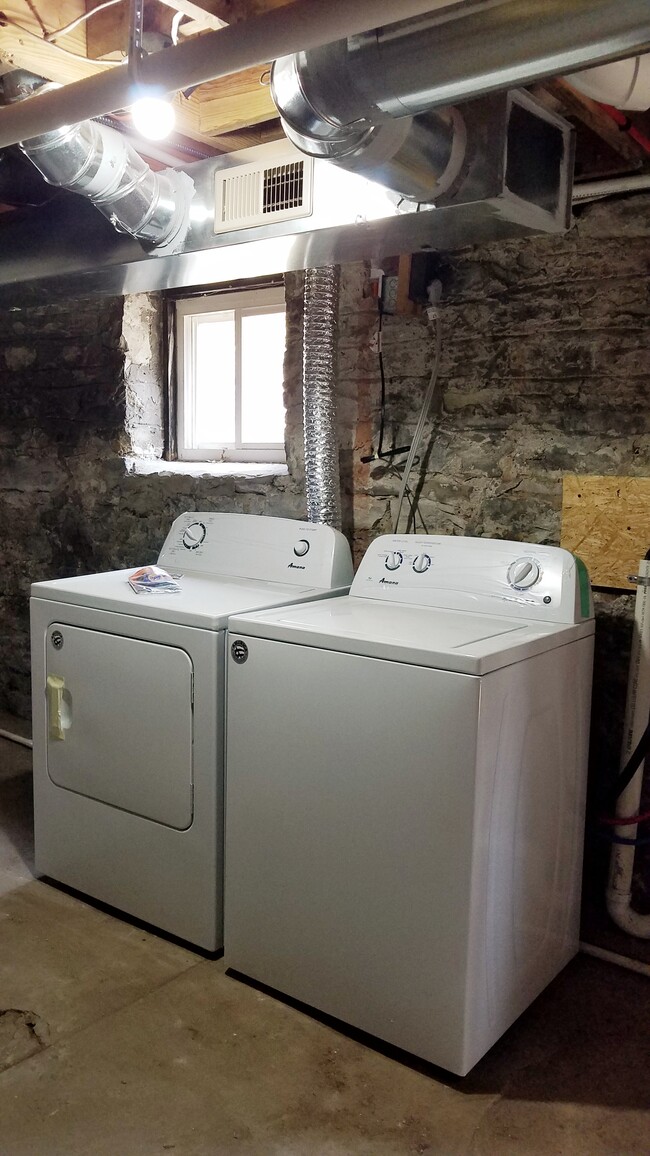 Washer and Dryer in Basement (image shows one pair but there are multiple sets for units to share) - 4410 Swan Ave