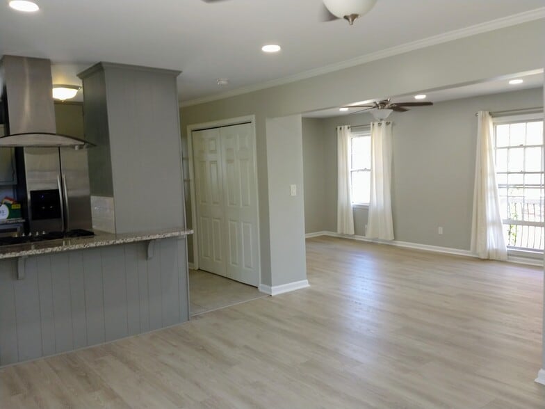 Kitchen open to dining and living room - 6457 Peacock Blvd