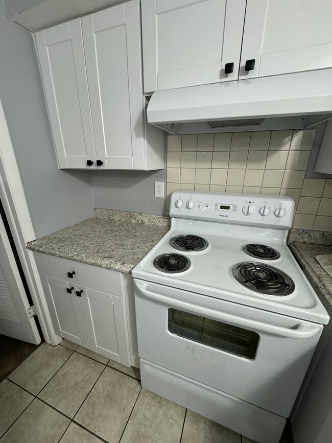 one year old stove and new cabinets and countertop - 4015 Tappan Dr