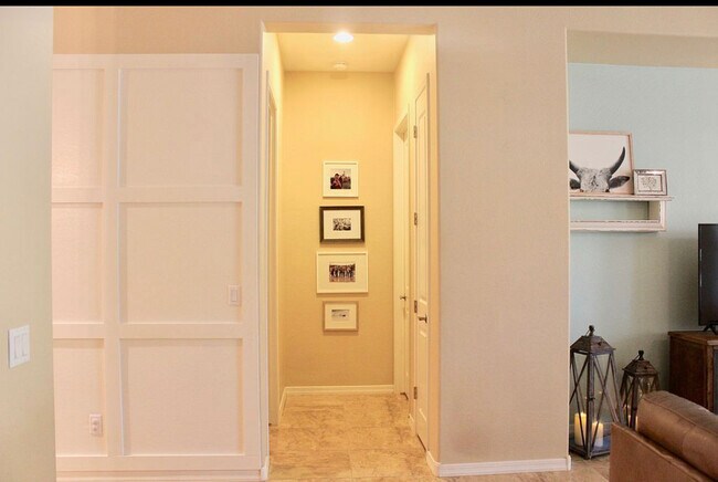 Hallway to laundry room and Primary bedroom. - 20892 W Eastview Way