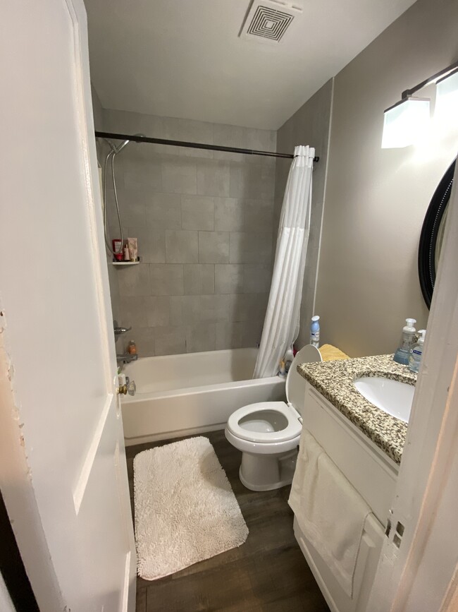 Tile surround bathtub, granite counter, new cabinetry - 604 1/2 Ward Avenue N.E.